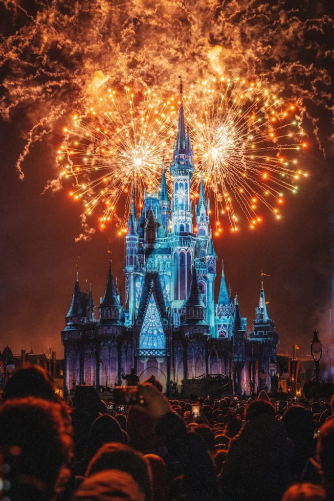 Enchanting fireworks illuminate the iconic castle at night, creating a magical celebration atmosphere.